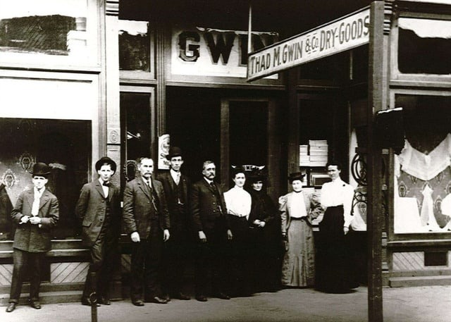 Thad M. Gwin with employees