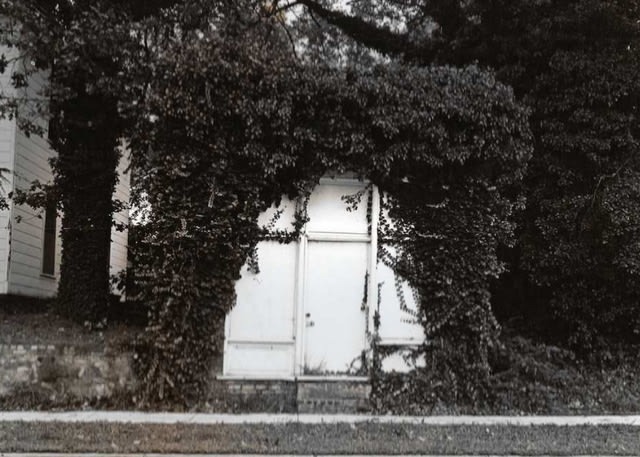 Whiteside-Williams Medical Office overgrown by ivy, c. 1979